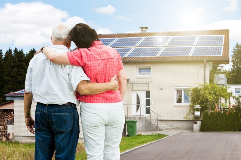 couple admiring solar on house