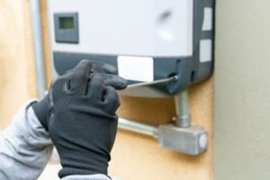 man installing solar inverter